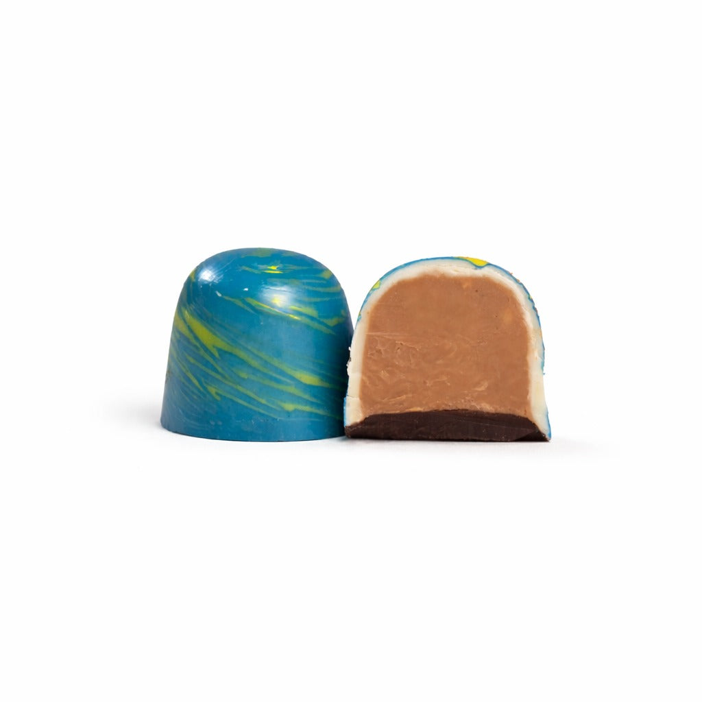 Two chocolate candies with marbled patterns on a white background